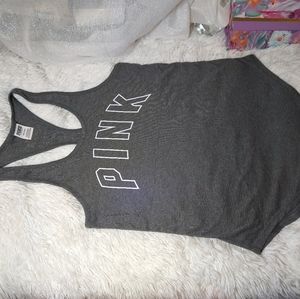 Pink t-shirt color gray with logo in front